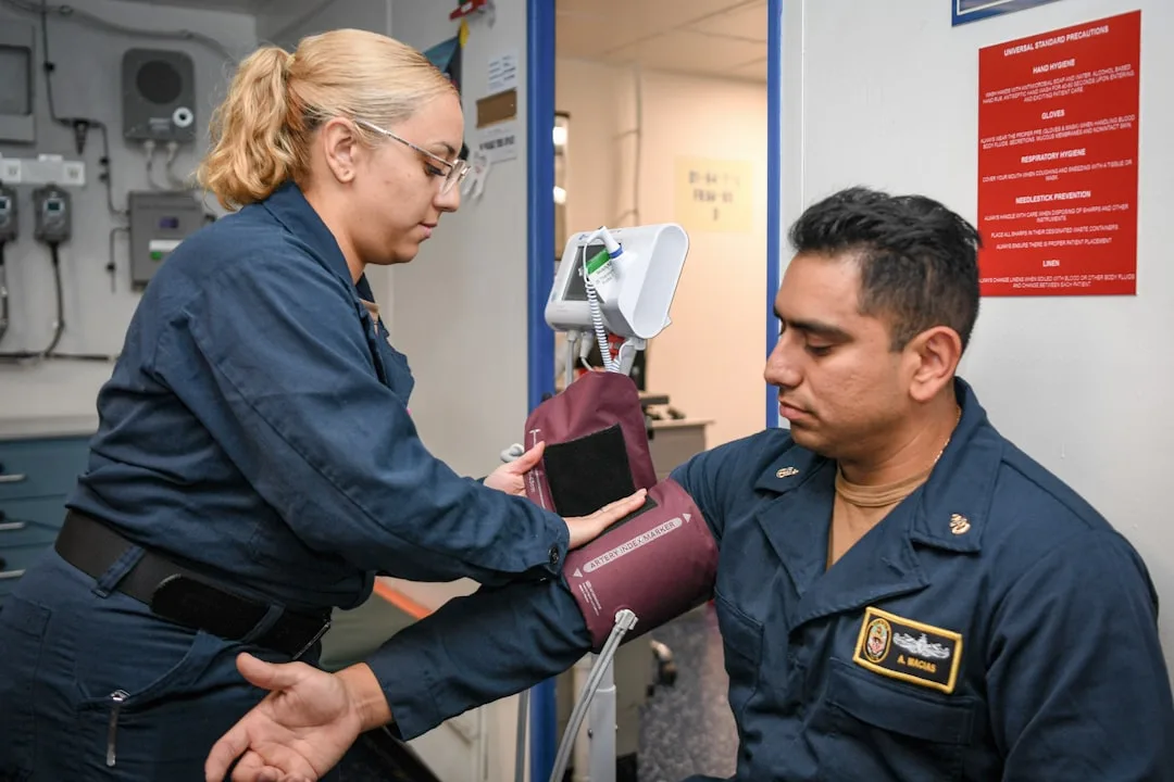 Energieloket — Medical professional taking a sailor's blood pressure.